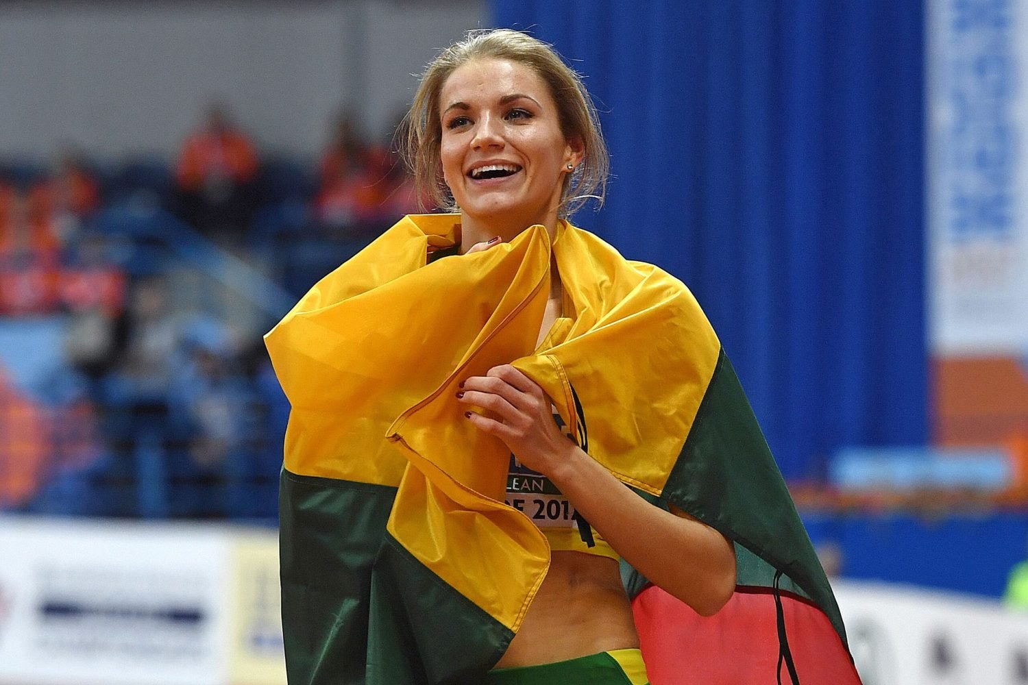 Lithuania's Airine Palsyte celebrates after winning the women's high jump final at the 2017 European Athletics Indoor Championships in Belgrade on March 4, 2017. / AFP PHOTO / Andrej ISAKOVIC